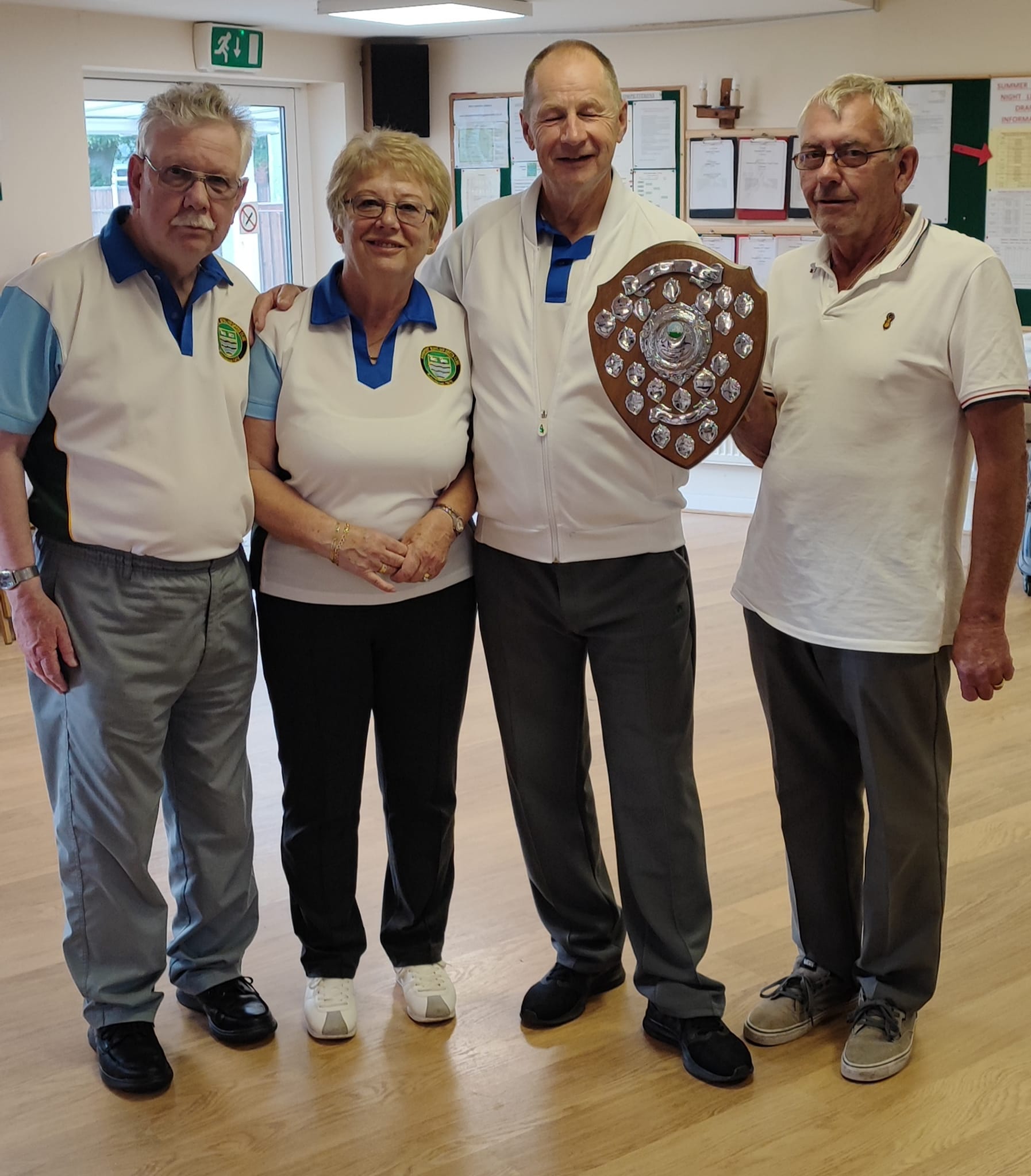 Mixed Triples Winners Peter Cooke Barbara Dexter John Little with Alan Guest presenting the shield.