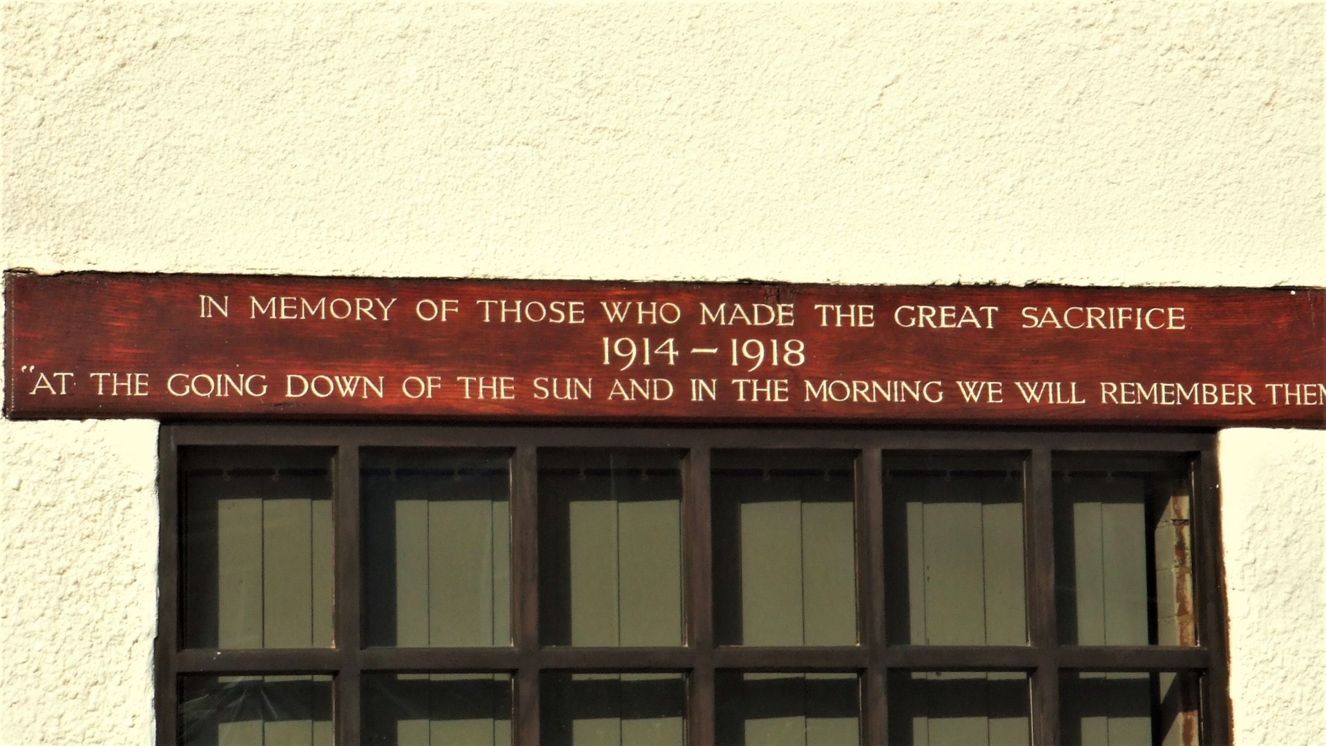 A memorial above the front facing Village Hall window