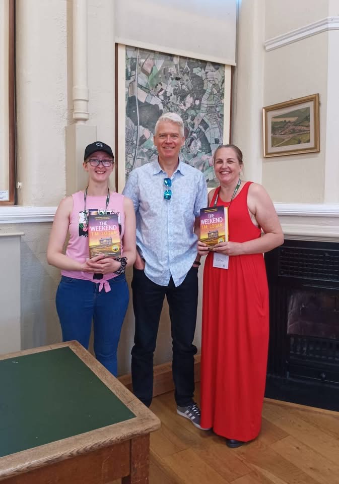 TM Logan with two volunteers