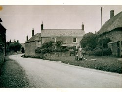 Warenne House, woman and cart outside Manor Cottage.