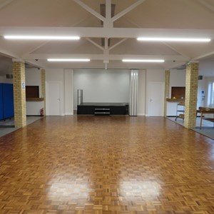 View of the main hall showing carpeted side areas & Stage