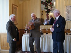 Dave Nicholls (left) winner of 'Club Member of the Year' with Ron Coyde last years winner presenting the 'Bowl' and President Brian Smith