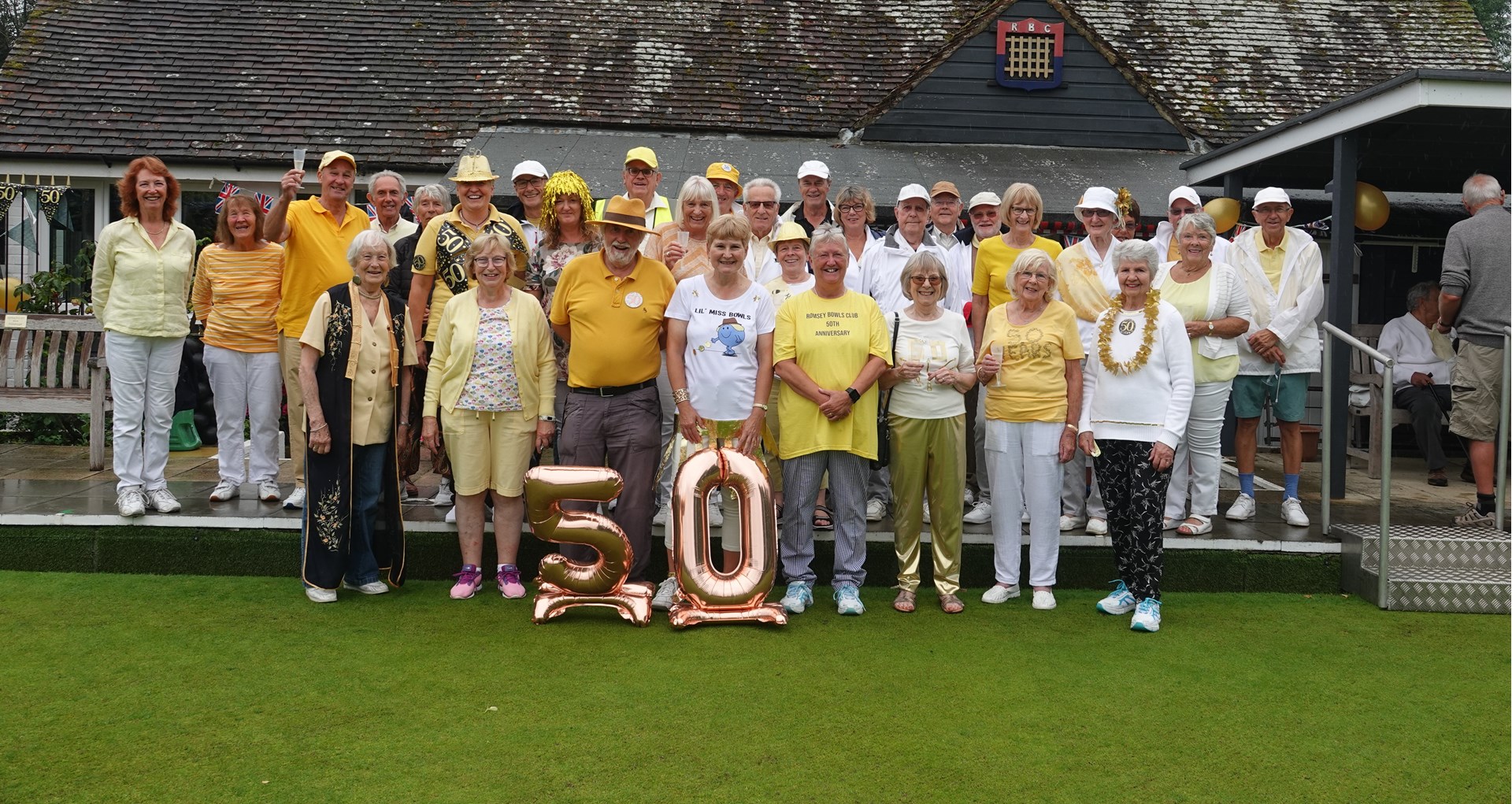 Happy but wet Romsey Bowlers on their 50th Anniversary