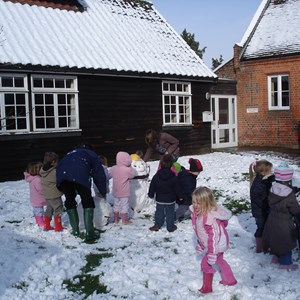 Playing in the snow at St Leonards Playschool
