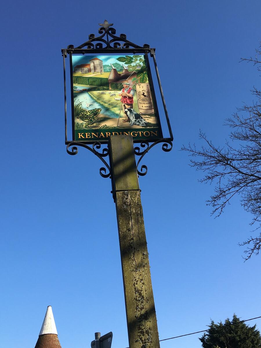 Village sign, handpainted by local resident artist Tom Pollard