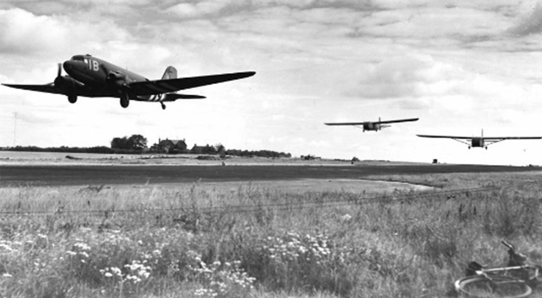 C-47 pulling two Waco gliders taking off from RAF Welford 1944