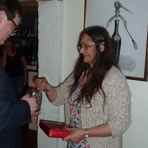 Mary Simmonds receiving her raffle prize from Luke Jamieson