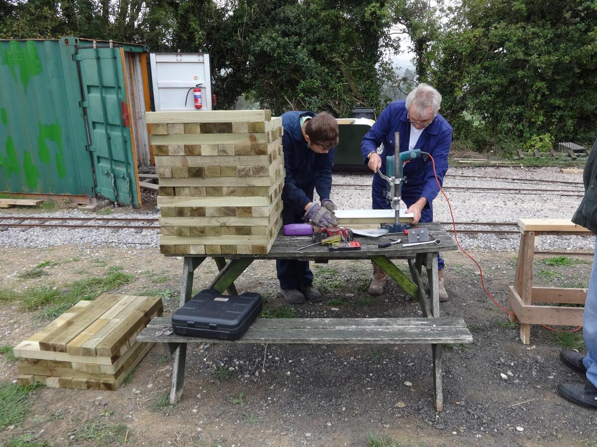 Ben and Martin P drilling sleepers for new track panels.
