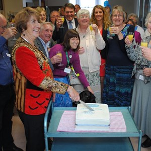 The Lord Mayor, Councillor Lynne Stagg cuts the celebration cake.