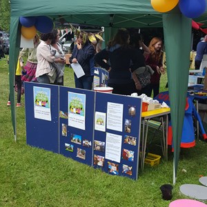 Brownies stall with yellow and blue balloons at May Fayre in Stoke