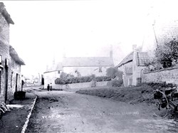 View of Chapel, Manor Cottage and Warrenne House on the R, Clayton Villa as a shop(?) on the right. Cart, woman and child. (Ault Stanford)
