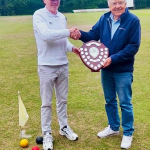 Chris Higgins receives trophy for Bishop Monkton winning Level Play League last year