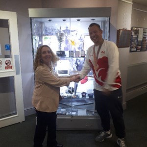 Daventry Town Council Mayor Lynne Taylor congratulating David on winning a Bronze Medal at CWG18