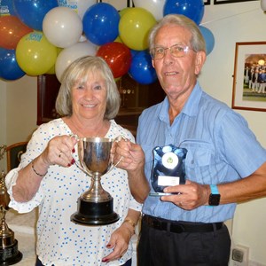 Gus Edwards receiving the Two Woods winners Trophy from Ladies Captain Linda Draycott at the Clubs Presentation Evening