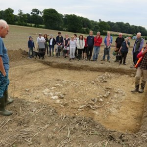 Daily briefing from Matt – Trench 3 beautifully excavated by Agata and Roger. It shows the pad which would have supported one of two of the gate posts immediately opposite the main villa and the wall connecting it to the smaller building.