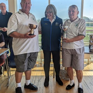 Pat and Roger receive the Club League winners cup and Club KO Cup