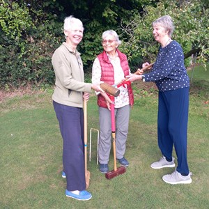Di Jesinger congratulating Gill Money and Dorte Summerhayes on winning the Ladies Croquet Final