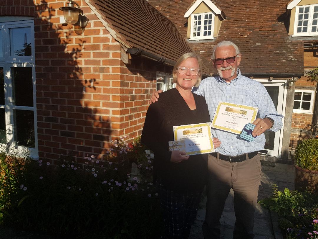 Karen Gazey & Den Hackett with their award for village champion 2023