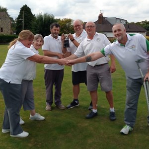 Keith Cusdin, Richard  Lambert & Colin Wagstaff receiving the Drawn Triples Cup from runners up Jeannie Hutton, Colleen Laker & Jonny Abbott