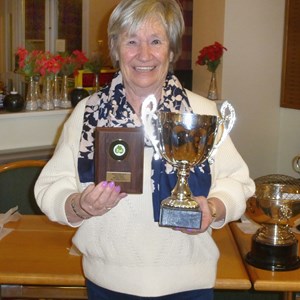 Linda Draycott receiving the Mens Handicap and yardstick 2022 trophies on behalf of Bill Draycott