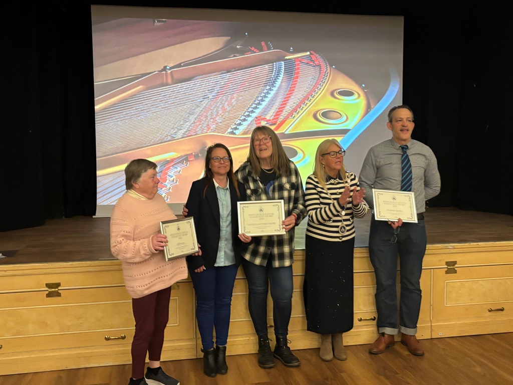 Carol and Bridget with their framed Community Award certificate