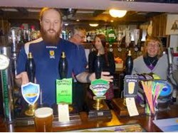 Sandy behind the bar