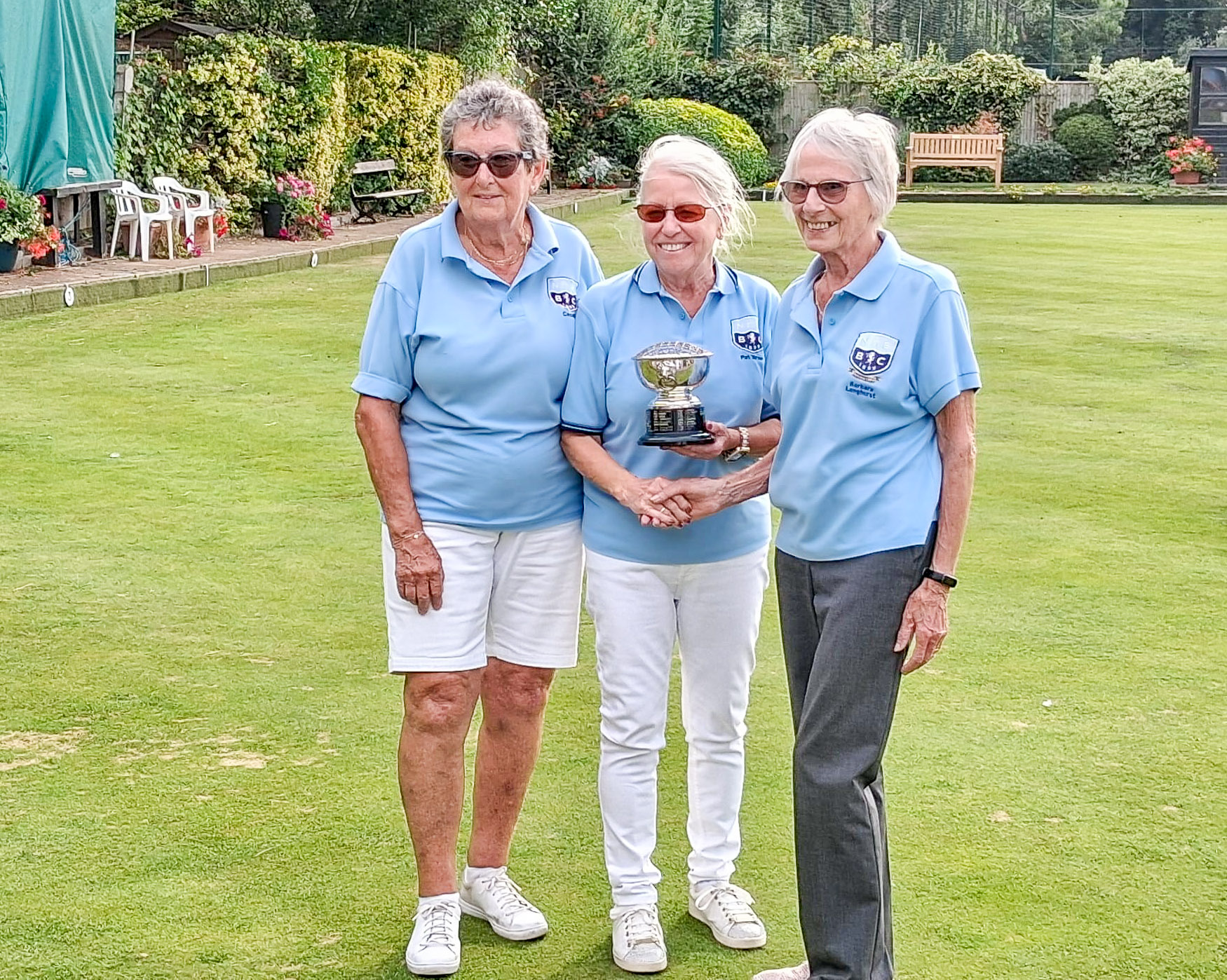 Pat Turner presenting the trophy to Barbara Longhurst with runner up Cecelia Unwin