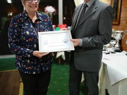Sandie receiving the award from Councillor Martin Archer