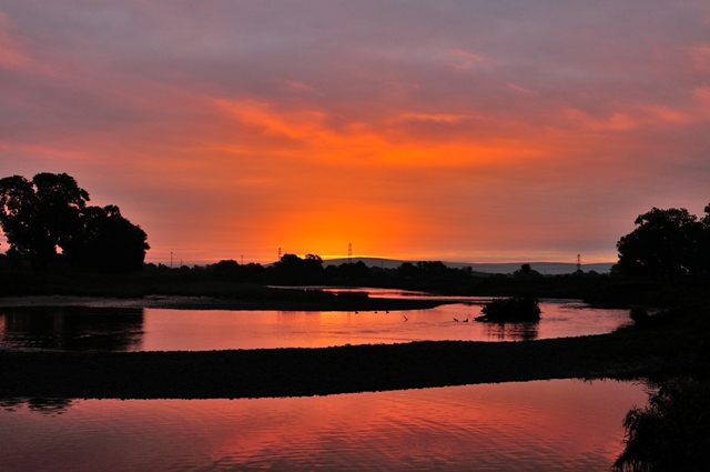 Photograph of the River Eden from Beaumont Parish Hall. Taken by Stephen Lloyd-Smart.