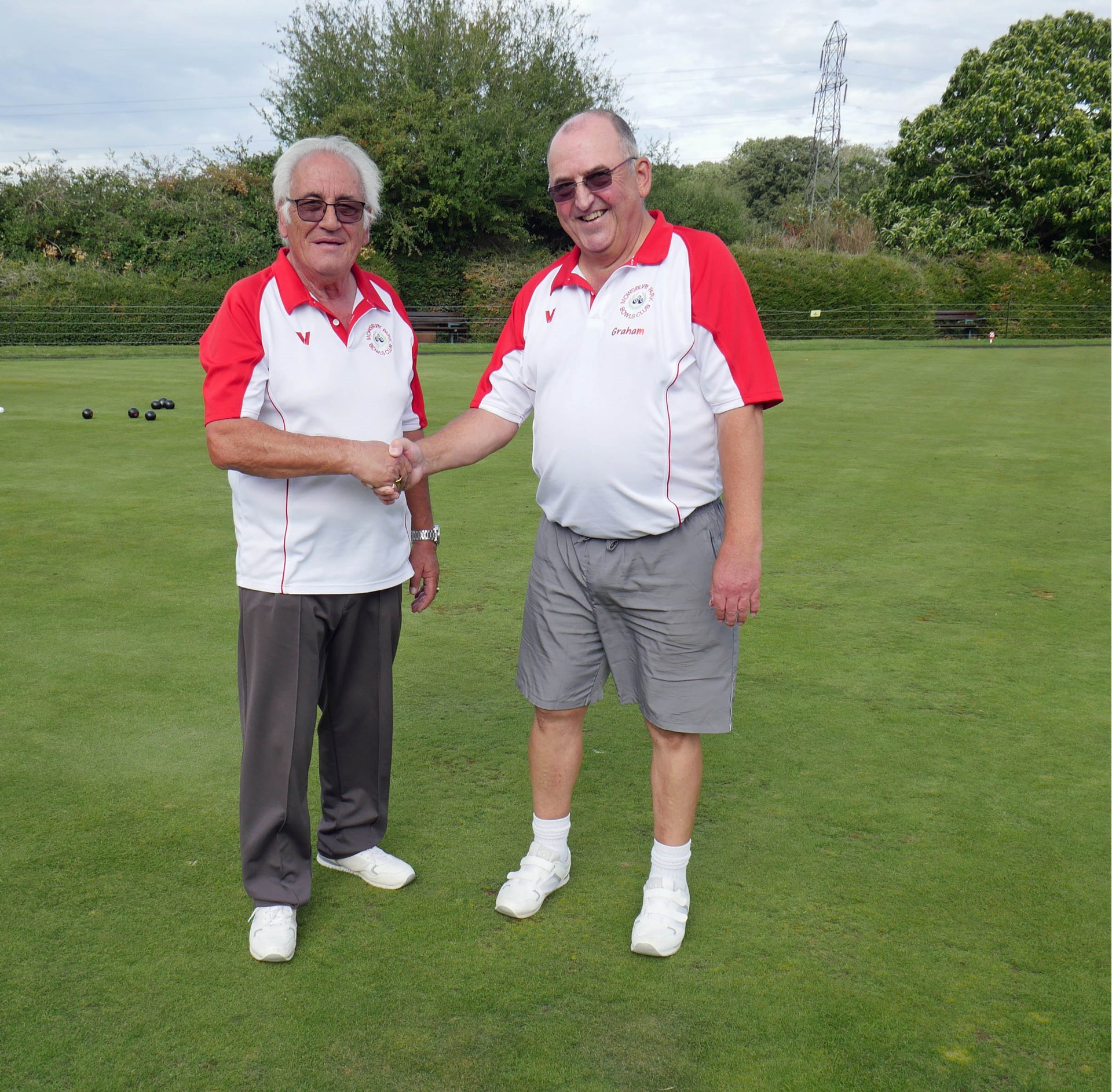 John (left) congratulating his opponent Graham Cunningham on winning the Men's Singles