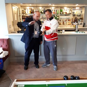 Leader of Northampton Borough Council getting some Bowls Tips from David at Northampton Whyye Melville Bowls Club based at Fernie Fields in Moulton
