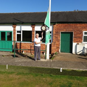 President Rachel Bonsor Lowering the Club Flag at the Closing of the Green