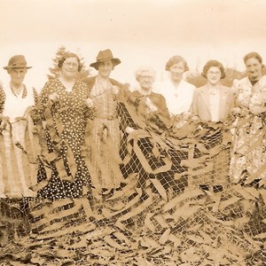 Local ladies with camouflage netting