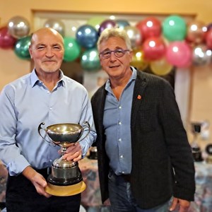 Bill Griffiths being Presented with the Fixed Jack winners Trophy by Paul Ugo