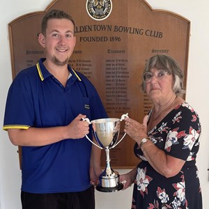 Joan Morgan presents the Rhidian Morgan Challenge Cup to winning captain, Alix Rouse