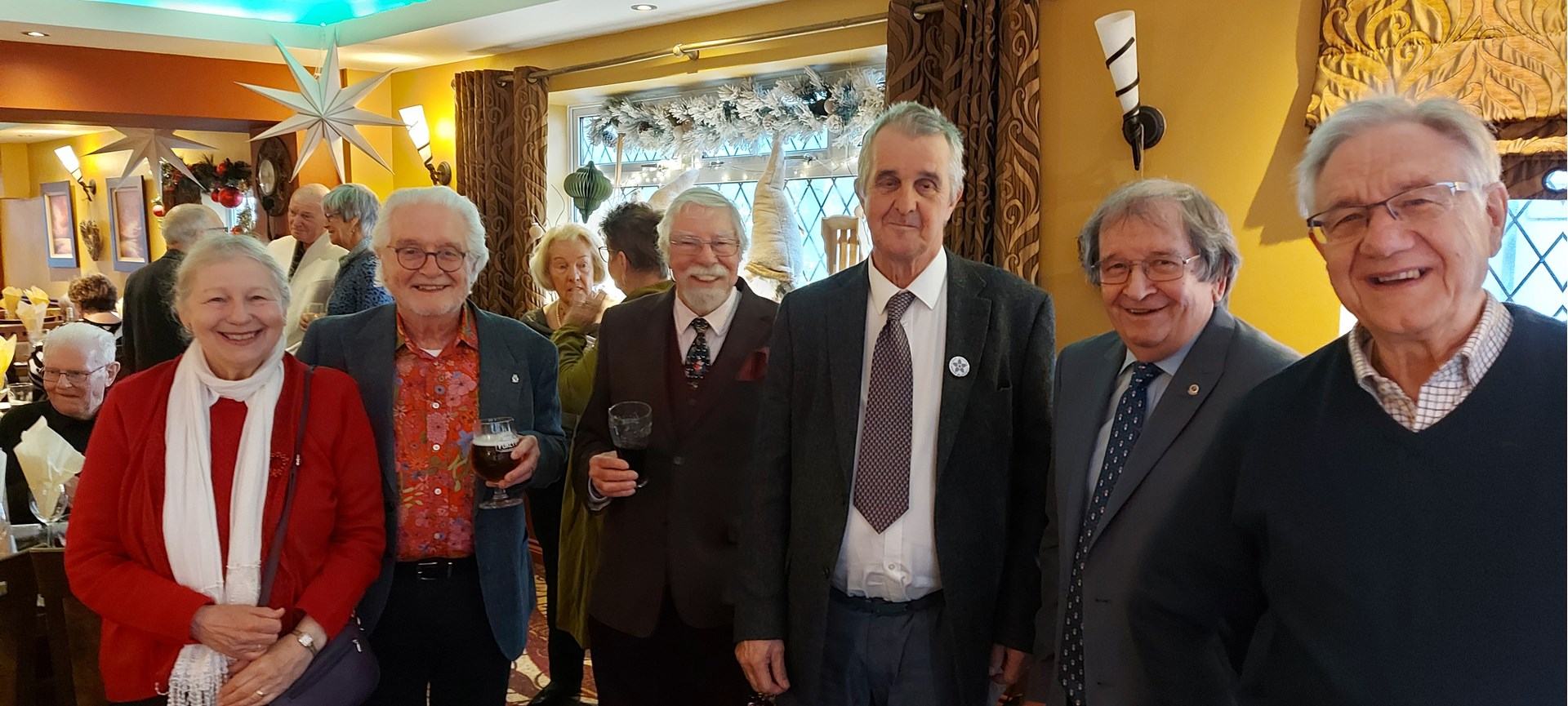 Christmas Luncheon organiser David Jeffery (3rd right) and Chairman Dave Kirk (2nd left) with members and friends