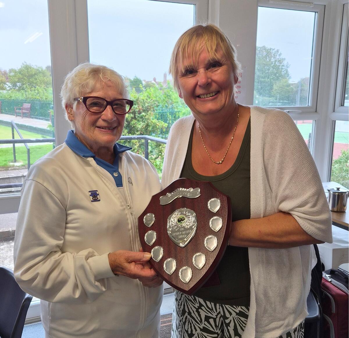 Arthur's daughter Carol presenting Pamela  Keene  with the Shield