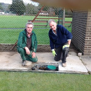 Headgreen Keeper Steve Callard with Dave Johnson installing pop-up watering system
