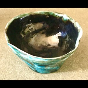 Golden Pinch : Ceramic pinch pot glazed with copper oxide Outer and brush on gold Inside. by Jan Flynn