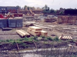 1986 Buildings rising from the Playing fields
