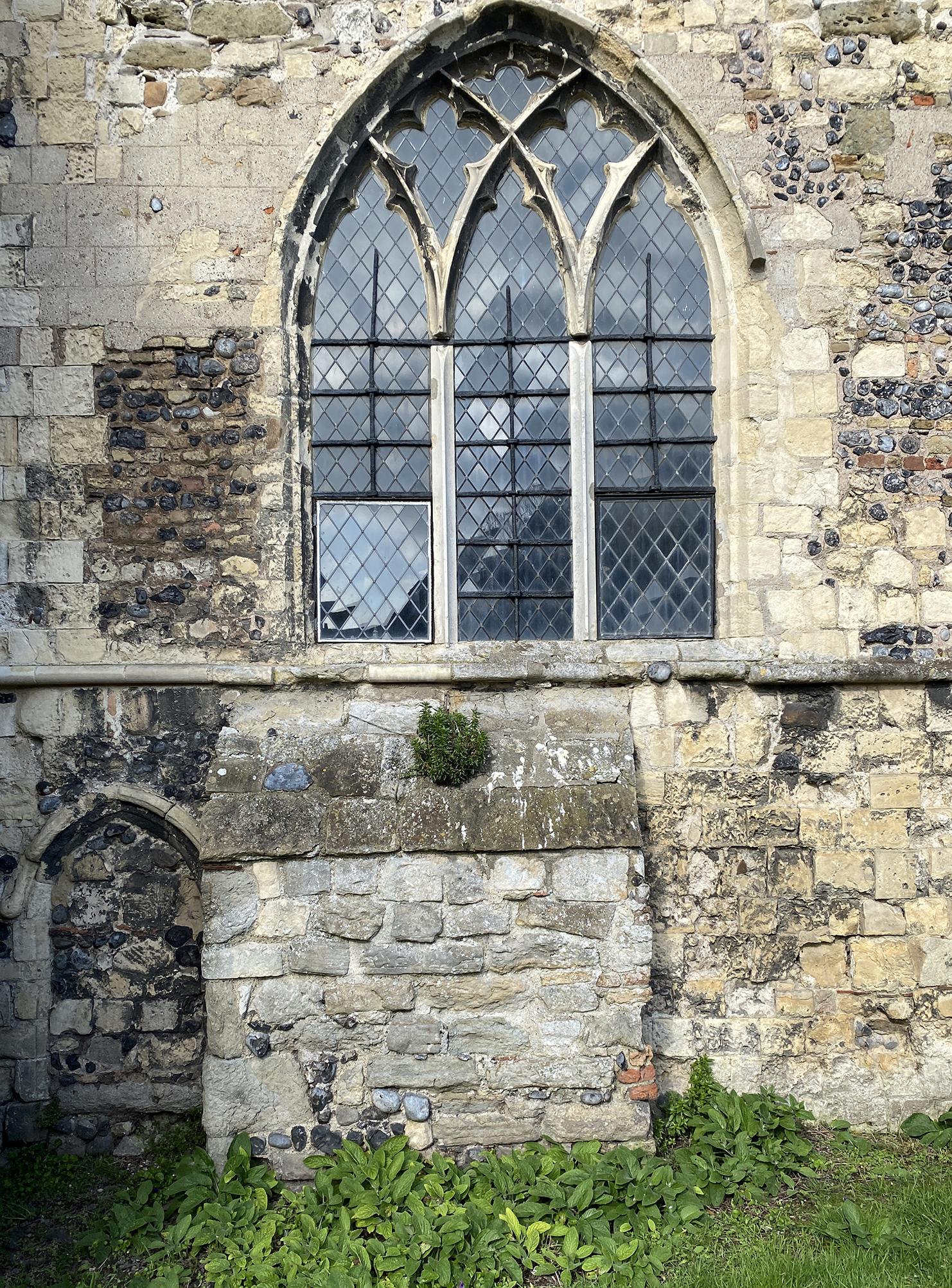 SouthWall chancel window with tomb of (probably)William Lord Clinton founder of the Carmelite friary. with blocked C13 doorwy
