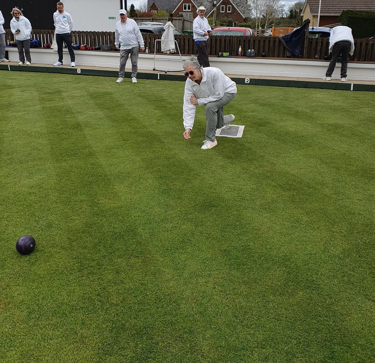 President Liz Dyer sending down first ceremonial wood of the 2026 season