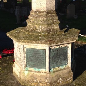 Commemorative plaques at the base of the North Collingham Memorial Cross