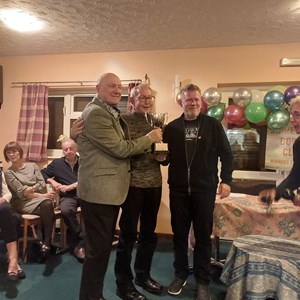 Angus Mullin presenting the Triples Trophy to winners Tarry Crane and Martin Taylor (Ian Kirsch not available)