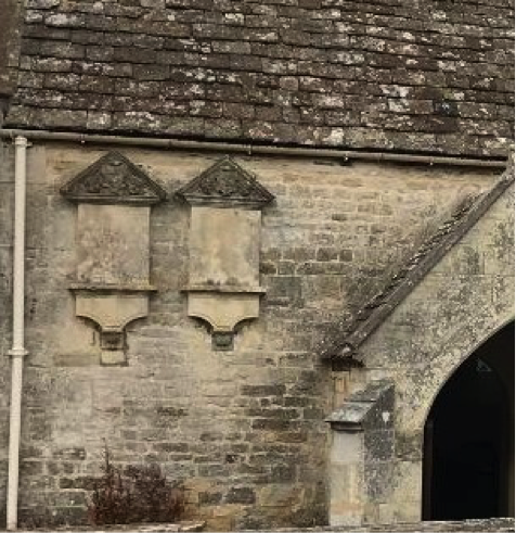 Plaques relating to the Huntley family on the outside of Harescombe church