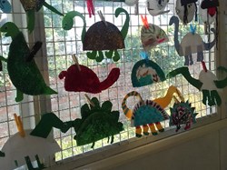 Dinosaurs and Snowmen window display at Play Scheme