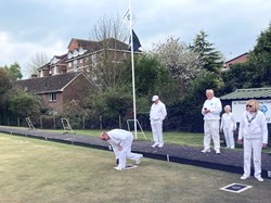 Club captain, Brian Ofield, bowls the first wood