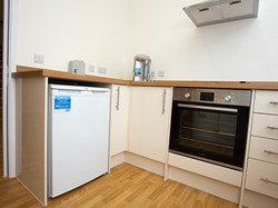 The kitchen is equipped with  a fridge, kettle, microwave and water boiler.