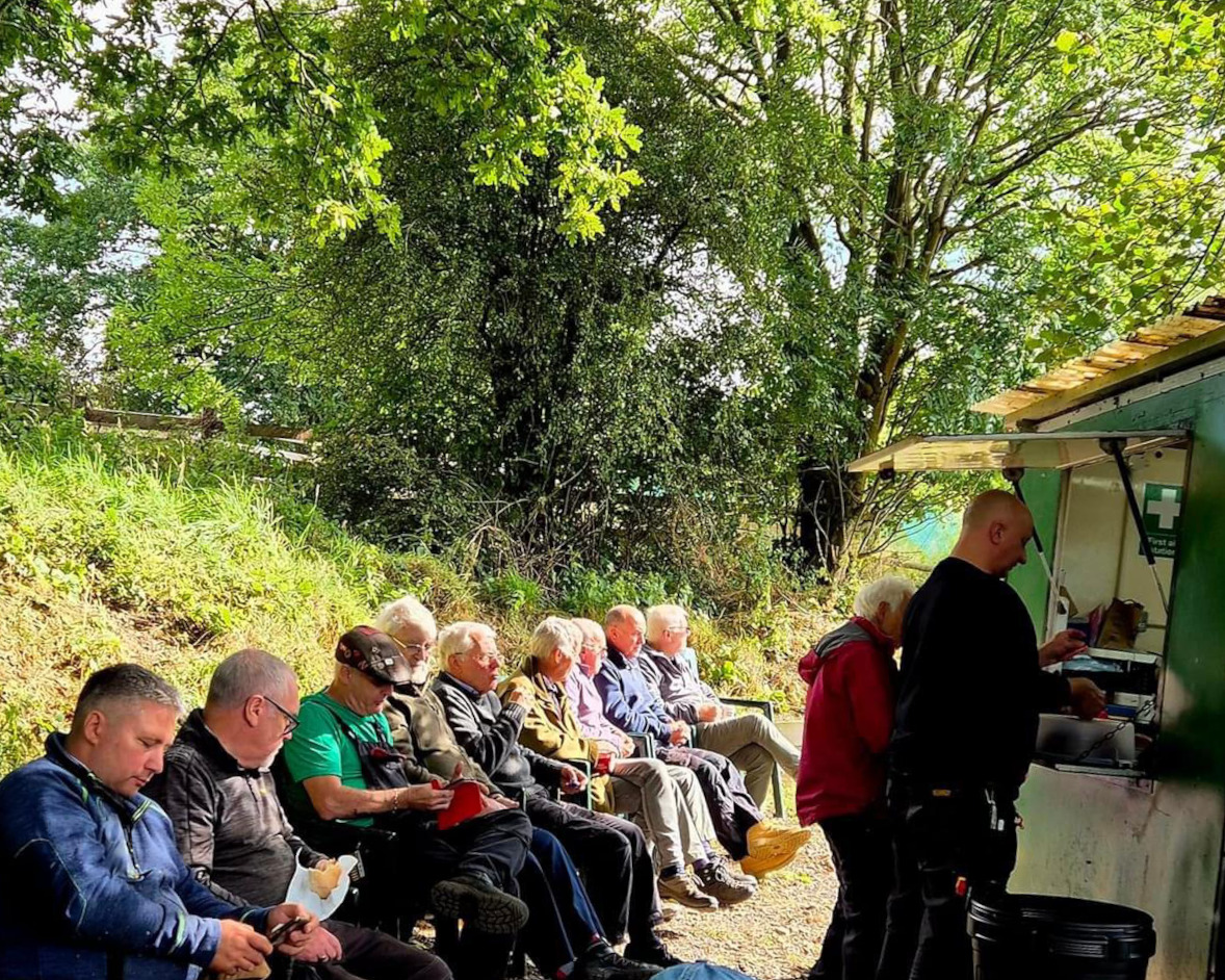 Feeding time at the shed. Hungry shedders enjoying sausage and bacon cobs  from Sonja's cafe.