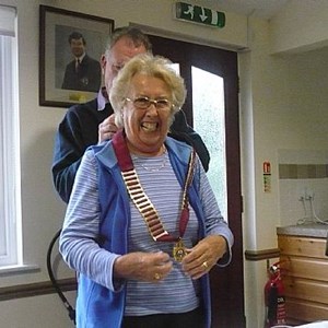 Outgoing President David concludes his Presidential Centenary Year by passing on the President's Chain of Office to incoming President for 2015/16 - Mrs Marlene Rodgers at the Club AGM.